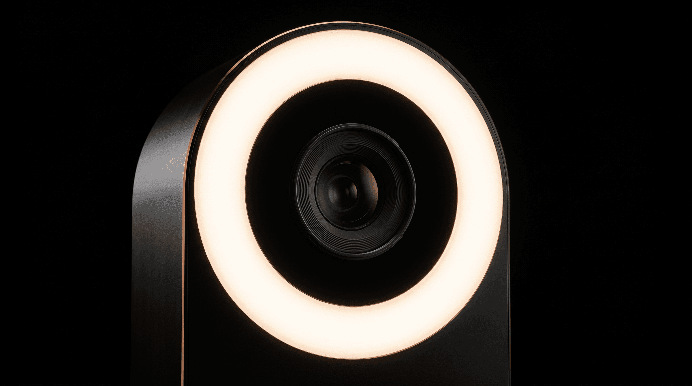 A close view of the ring light and lens on a Signal Frame capture station against a black background.